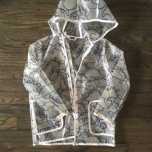 Transparent raincoat with dinosaurs.